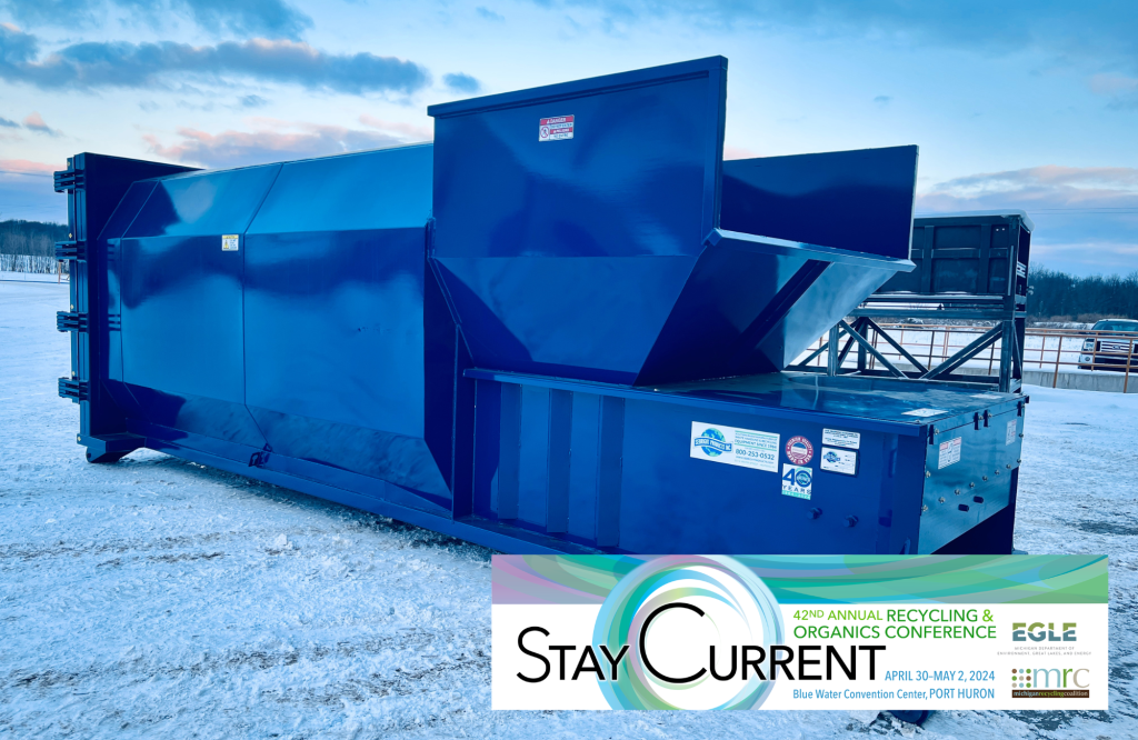 Blue compactor in the snow